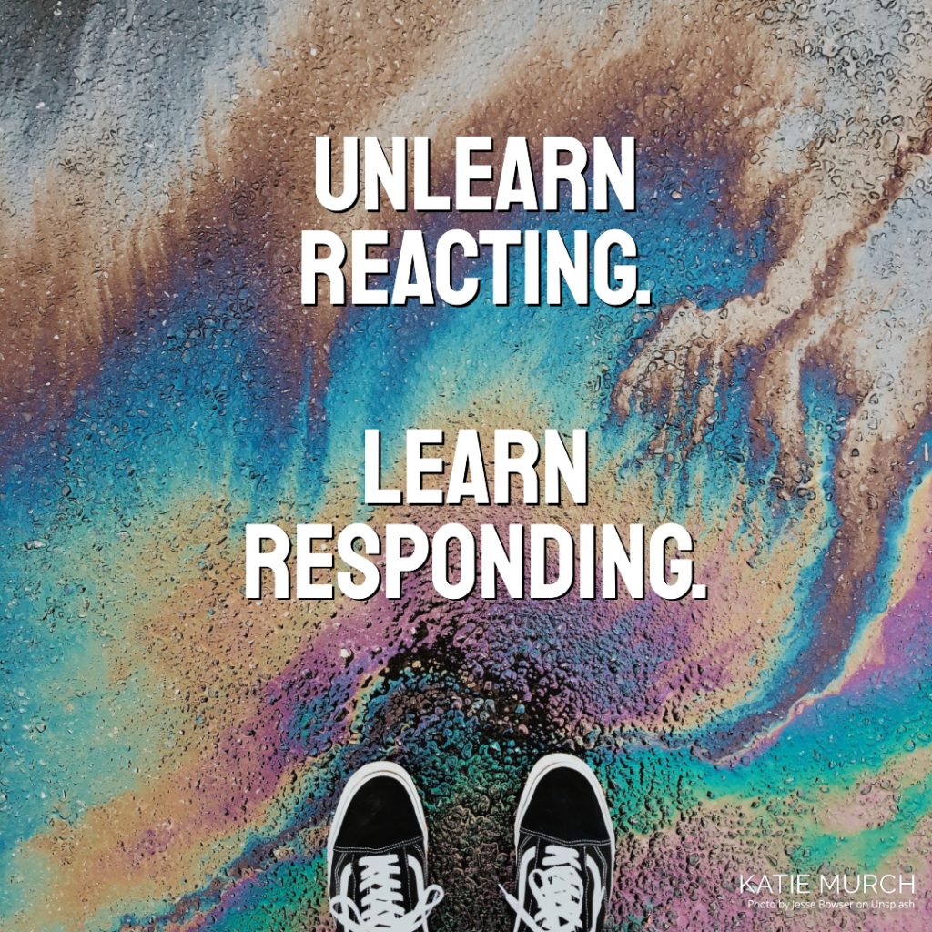 Quote is in front of the asphalt covered with oil reflecting various colors. A pair of black vans shoes can be seen on the bottom. Katie Murch and photo credit is on the bottom right of the image.