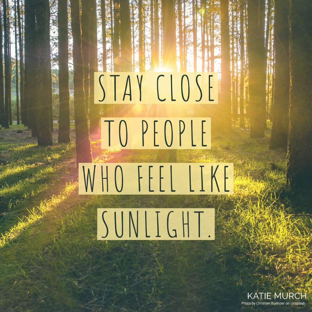 Quote is in the middle and in black font and a yellow highlight background. The image behind the quote is of a forest with sunlight filtering between tall trees. Katie Murch and photo credit is on the bottom right of the image.
