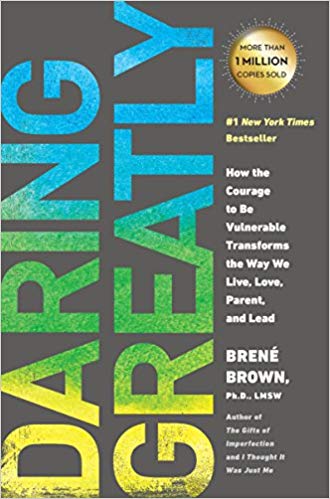 Book cover is grey with "Daring Greatly" in a yellow-blue-green ombre effect. A gold emnlem highlights, "More than 1 million sold" above the name of the author "Brene Brown, Ph.D LSNW".